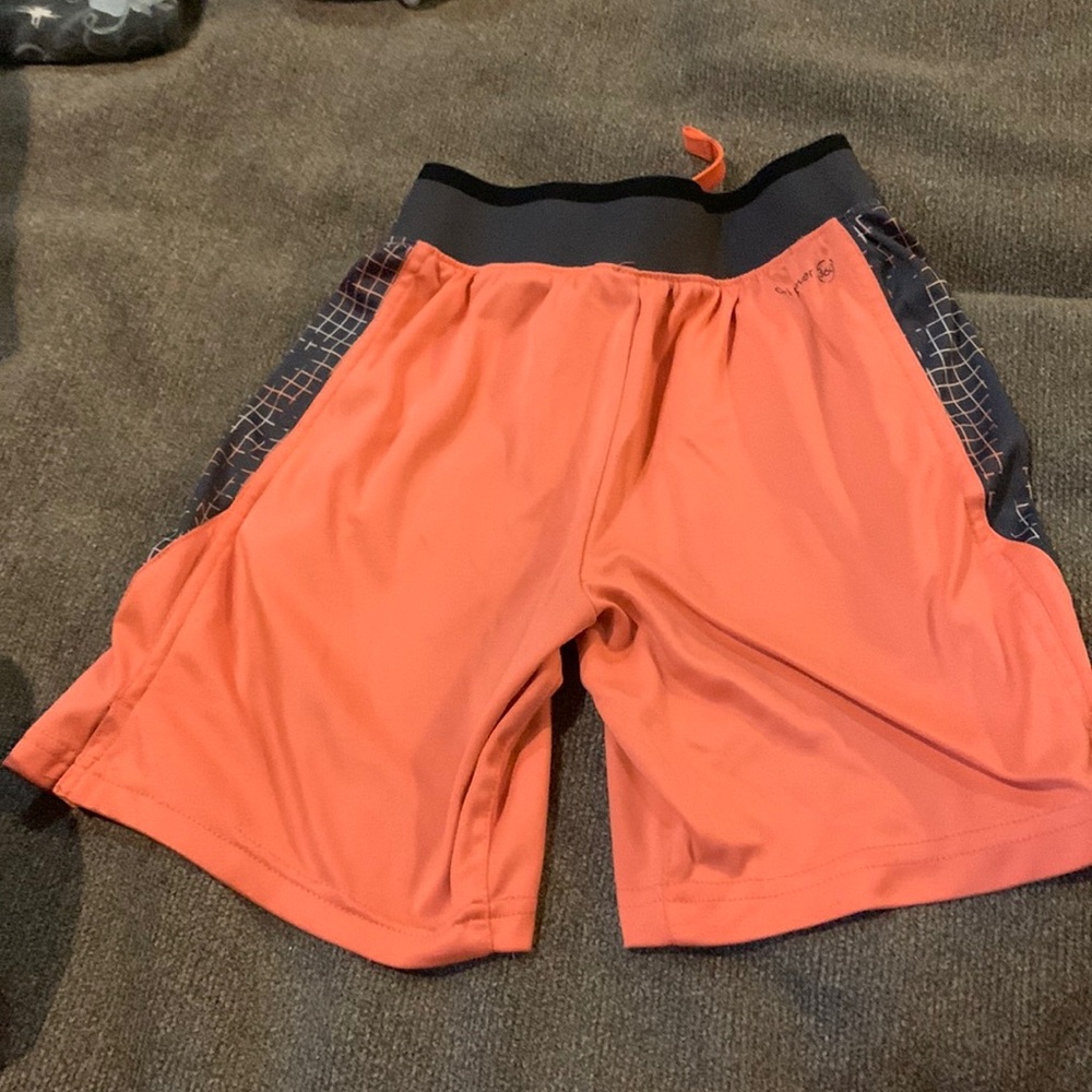 Size 8 boys shorts, orange, and gray with design in the side